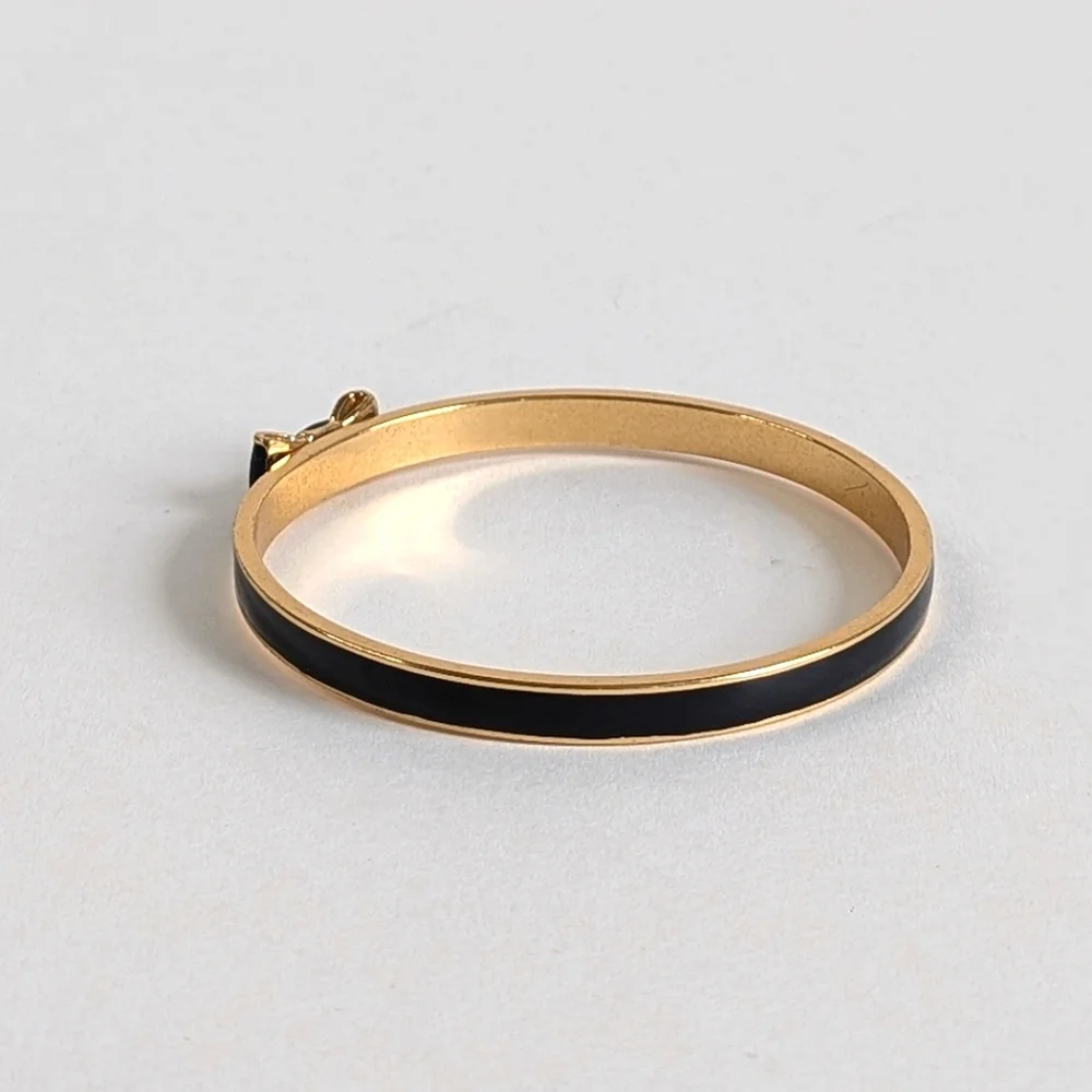 kate spade Black and Gold Enamel Bow Bangle Bracelet